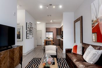 Wood-style flooring in entry, kitchen, living and dining areas